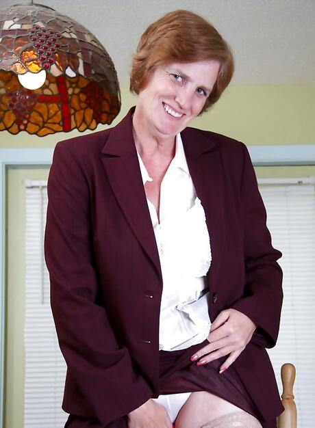 Hot red-haired aged Raylynn shows big boobies and hairy pussy 